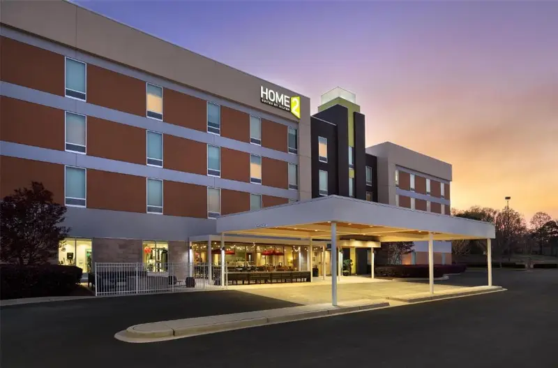 Home2 Suites by Hilton exterior under a colorful evening sky